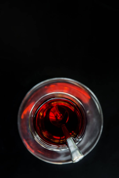 Turkish tea in national glass tea cups. Eastern oriental traditions, Turkey. Selective focus, shallow depth. Copyspace. - Photo, image