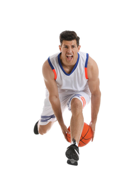 Professional sportsman playing basketball on white background - Foto, afbeelding