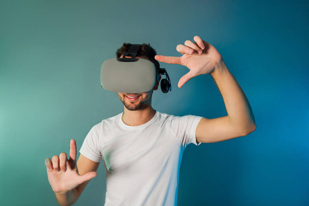 Man using virtual reality glasses for virtual shopping - Fotó, kép
