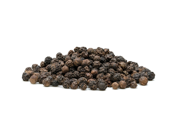 Black pepper pile or Black peppercorns seeds isolated on white background. - Photo, Image