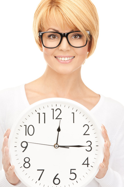 Picture of woman holding big clock over white - Photo, Image