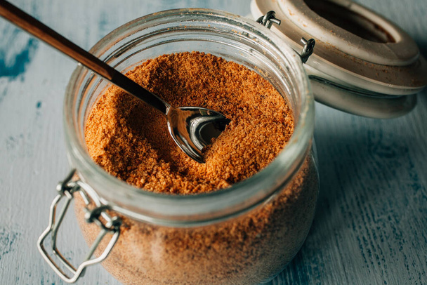 Panela sugar background. Close up view of raw cane sugar in a jar. Organic and healthy food. - Photo, Image