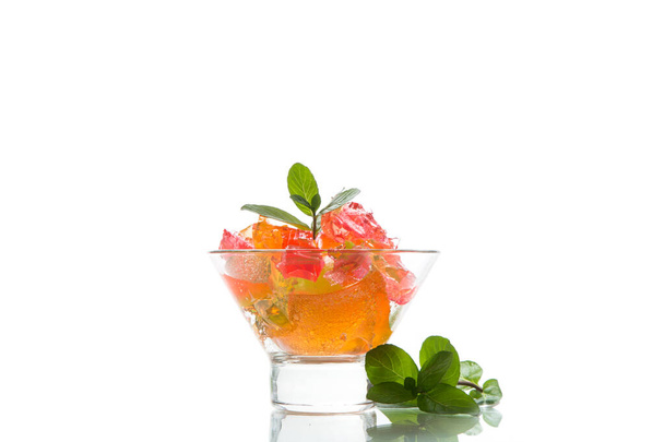 colored sweet fruit jelly in glass glass isolated on white background - Foto, afbeelding