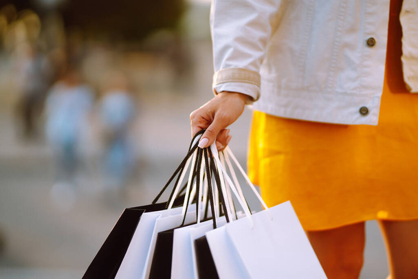 Shopping bags in the woman hands. Sale, shopping, tourism and happy people concept.  - Φωτογραφία, εικόνα