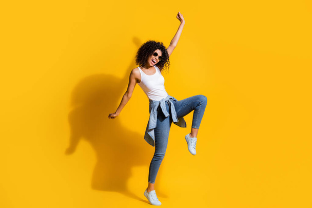 Full body portrait of crazy dark skin person raise hand knee open mouth enjoy disco isolated on yellow color background - Foto, Bild