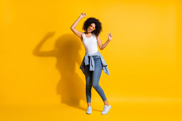 Full size photo of afro american girl wear jacket on waist dance isolated on vibrant yellow color background - Fotografie, Obrázek