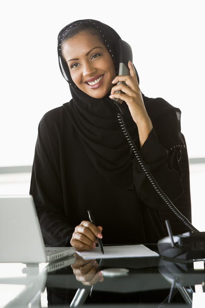 A Middle Eastern businesswoman using a laptop - Foto, Imagen