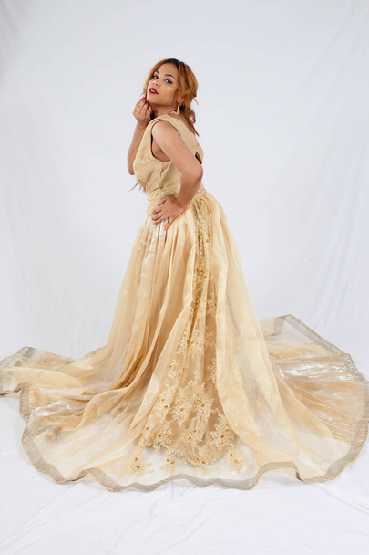Lovely Hispanic woman in a Long flowing Dress - Фото, изображение