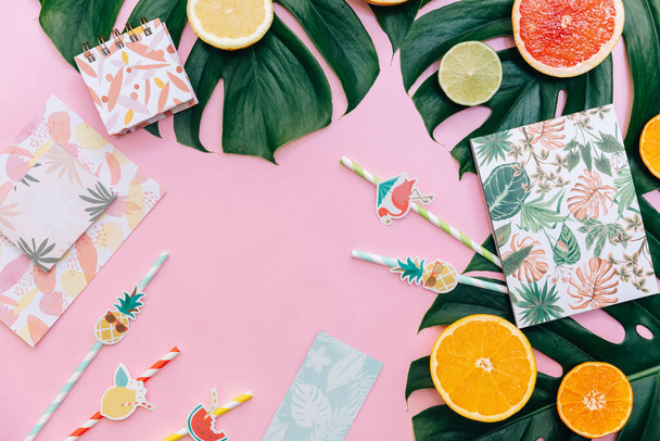 Flat Lay Summer tropical background. Workspace with supplies and fresh fruits. Top view, copy space - Foto, Imagen