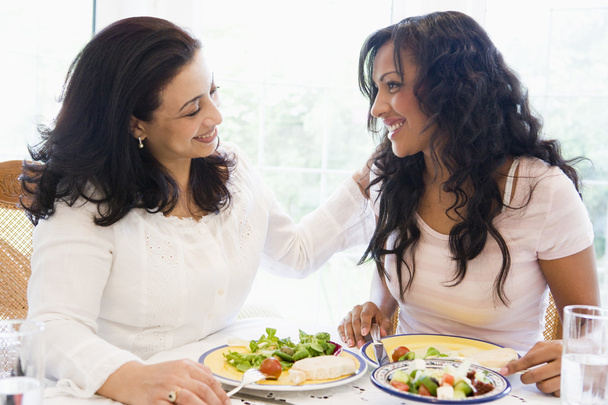 Two women enjoying a meal together - Foto, Bild