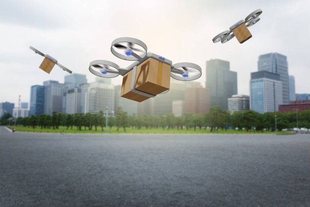 Drohne fliegt mit Lieferbox-Paket in eine Stadt - Foto, Bild