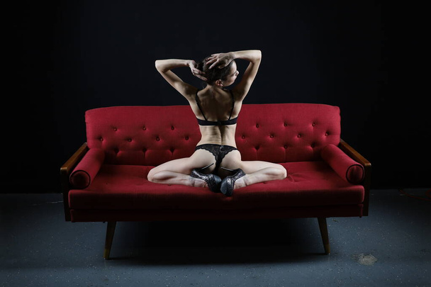 Photoshoot of a ballerina posing in a studio - Photo, Image