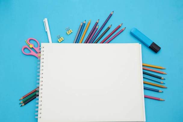 School notebook and various stationery. Back to school concept. - Φωτογραφία, εικόνα