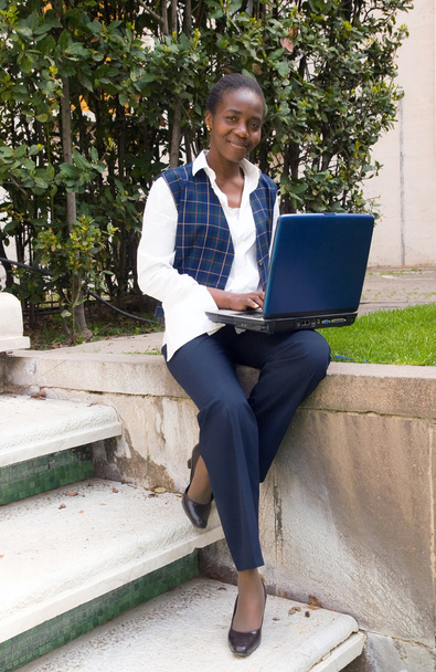Woman working with laptop outside - Foto, Bild