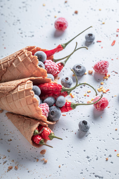 Fresh ice cream with berries and chilli. Unique icecream. New flavors of ice cream.  - Foto, immagini