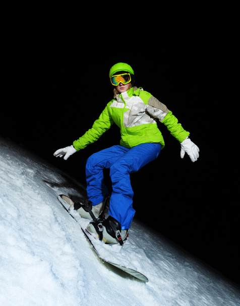 Young woman on snowboard - Zdjęcie, obraz