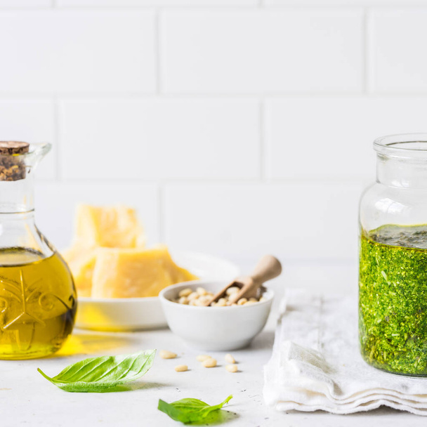 Pesto Sauce with  Ingredients: Fresh Basil, Pine Nuts, Olive Oil and Cheese, square, copy space for your text - Фото, изображение