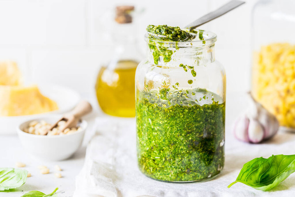 Pesto Sauce with  Ingredients: Fresh Basil, Pine Nuts, Olive Oil and Cheese - Zdjęcie, obraz