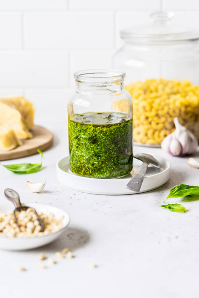 Pesto Sauce with  Ingredients: Fresh Basil, Pine Nuts, Olive Oil and Cheese, copy space for your text - Fotó, kép