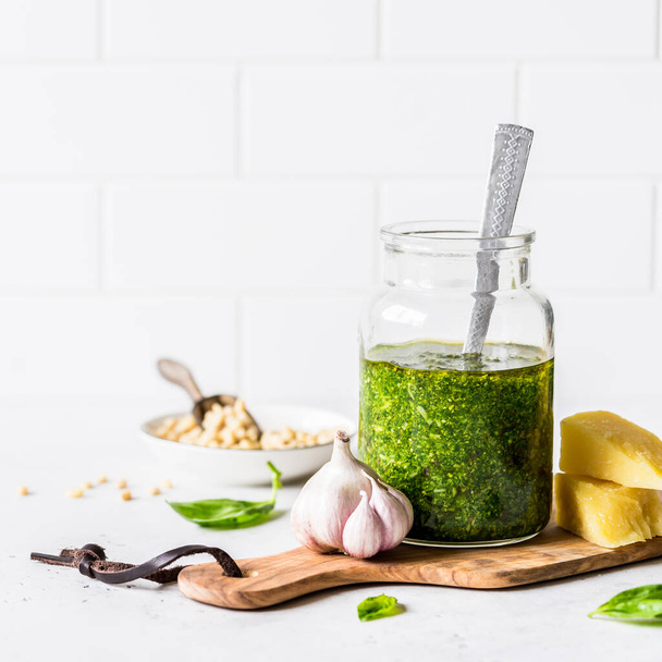 Pesto Sauce with  Ingredients: Fresh Basil, Pine Nuts, Garlic and Cheese, square, copy space for your text - Photo, image