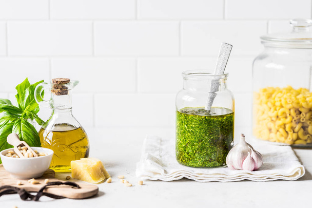 Pesto Sauce with  Ingredients: Fresh Basil, Pine Nuts, Olive Oil and Cheese, copy space for your text - Photo, image