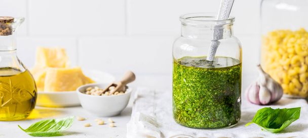 Pesto Sauce with  Ingredients: Fresh Basil, Pine Nuts, Olive Oil and Cheese, banner - Photo, image