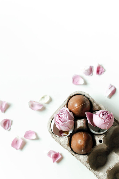 top view of beautiful pink flowers and sweets - Foto, Imagen