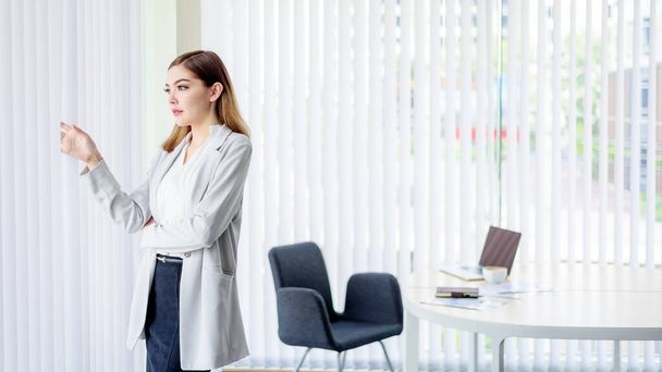 Young Beautiful Business Woman in White Modern Office Room with - Φωτογραφία, εικόνα
