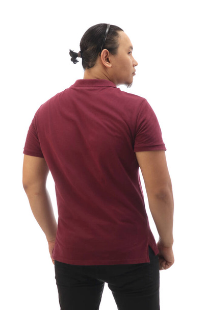 Rear view of Asian man with bun hair wearing maroon red shirt isolated cut out on white, looking to the side - Photo, image