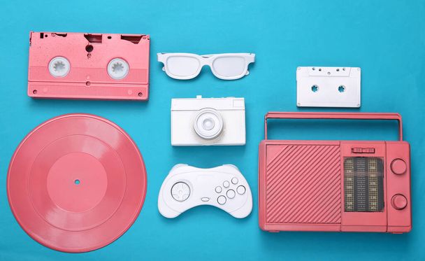 Retro hipster pink and white painted attributes on  blue background. Minimalism, creative layout. Flat lay. Creative art. Top view  - Foto, immagini