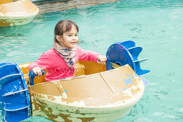Young girl in a pedal boat  - Фото, зображення