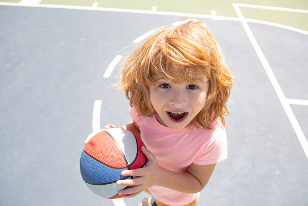 Kids excited play basketball, portrait of cute child. - Φωτογραφία, εικόνα