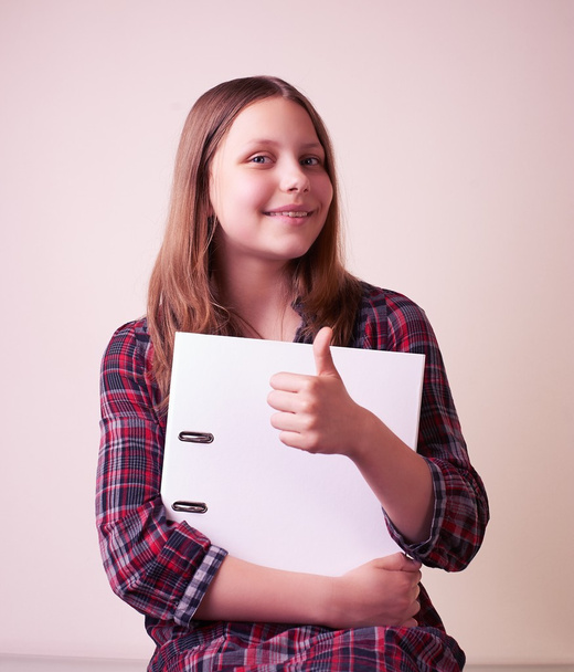 Portrait of a school girl with folder - Φωτογραφία, εικόνα