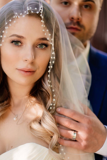 close-up portrait of the bride and groom. beautiful and romantic newlyweds.  - Photo, image