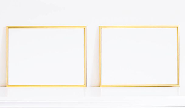 Golden frame on white furniture, luxury home decor and design for mockup, poster print and printable art, online shop showcase - Foto, afbeelding