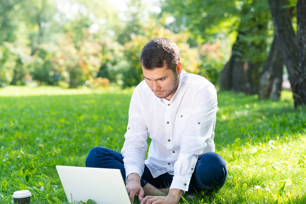 Young businessman using laptop computer - Photo, image