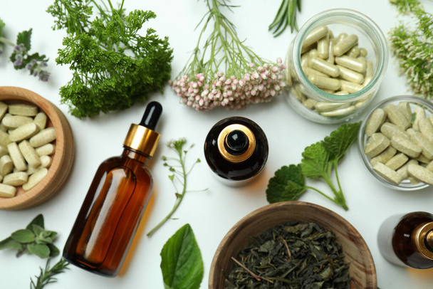Concept of herbal medicine pills on white background, top view - Fotoğraf, Görsel