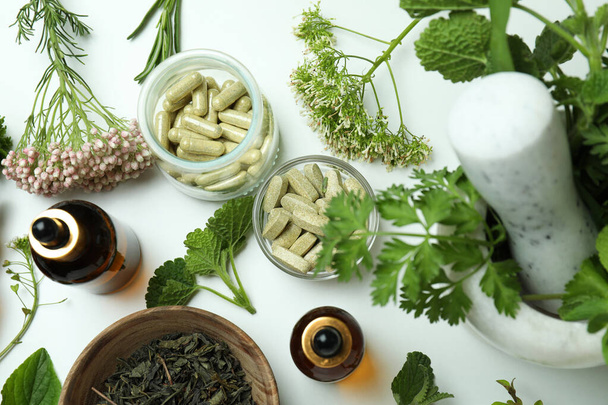 Concept of herbal medicine pills on white background, top view - Foto, Bild