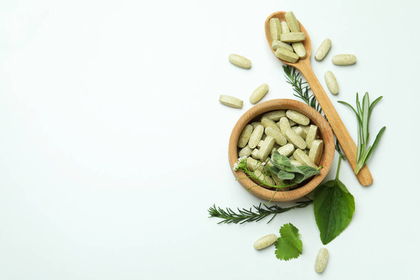Concept of herbal medicine pills on white background, space for text - Foto, immagini