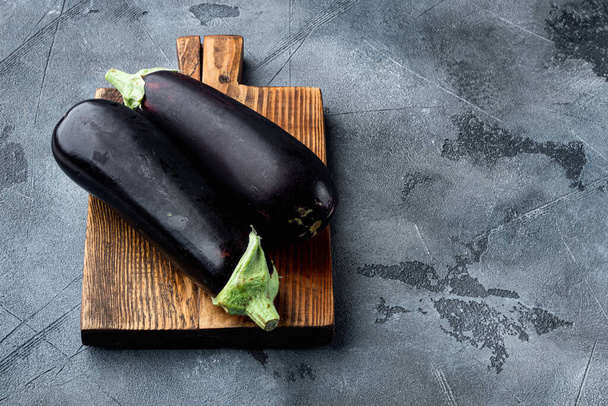 Healthy and delicious purple eggplants set, on gray stone background, with copy space for text - Φωτογραφία, εικόνα
