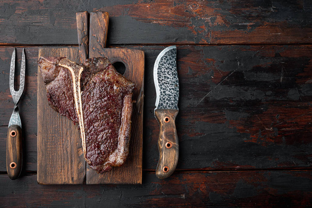 Roast t-bone or porterhouse beef meat Steak set, on wooden serving board, top view flat lay, with copy space for text - 写真・画像
