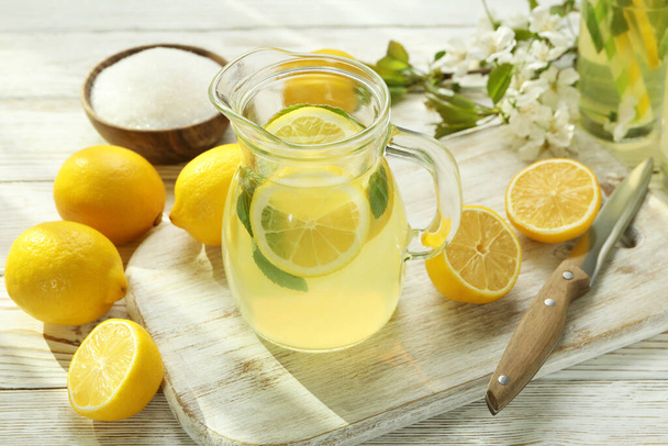Concept of fresh summer drink with lemonade on white wooden table - Foto, Imagem