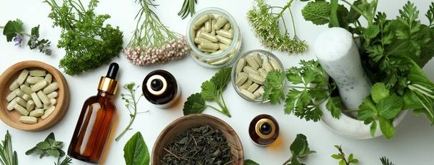 Concept of herbal medicine pills on white background, top view - Foto, Bild