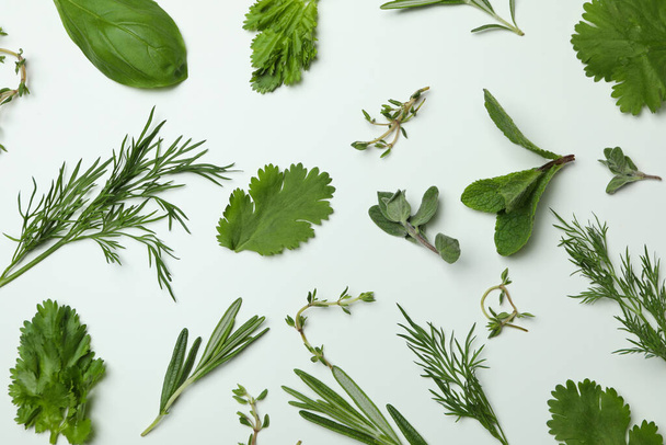 Fresh herbs on white background, top view - Foto, afbeelding