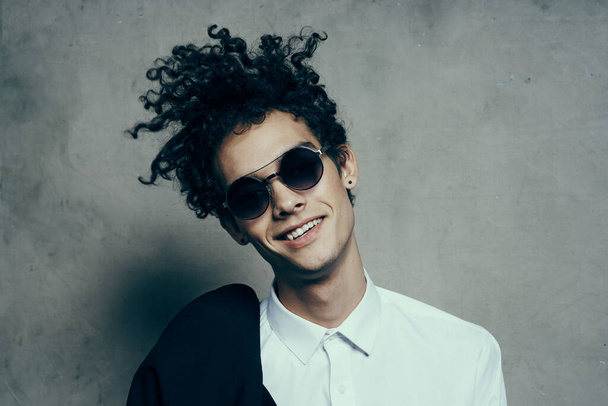 emotional guy with curly hair teen classic suit sunglasses shirt model - Foto, Imagem