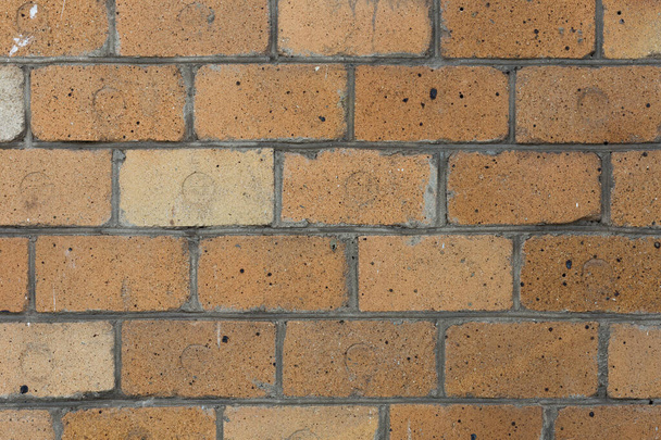 Wall of old refractory yellow brick for background and design. Grunge texture. - 写真・画像