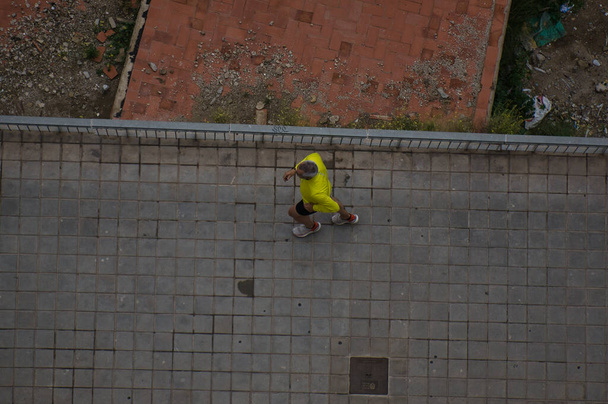person doing exercises in the streets of the city of Alicante, in the Valencian Community, Spain. view - Photo, Image