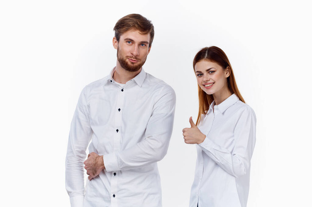 business finance employees at work man and woman in identical shirts - 写真・画像