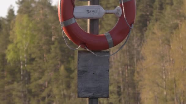 Closeup shot of a lifebuoy on a sunny day. - Footage, Video