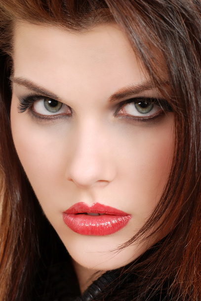 Closeup headshot young brunette woman with red lipstick - 写真・画像